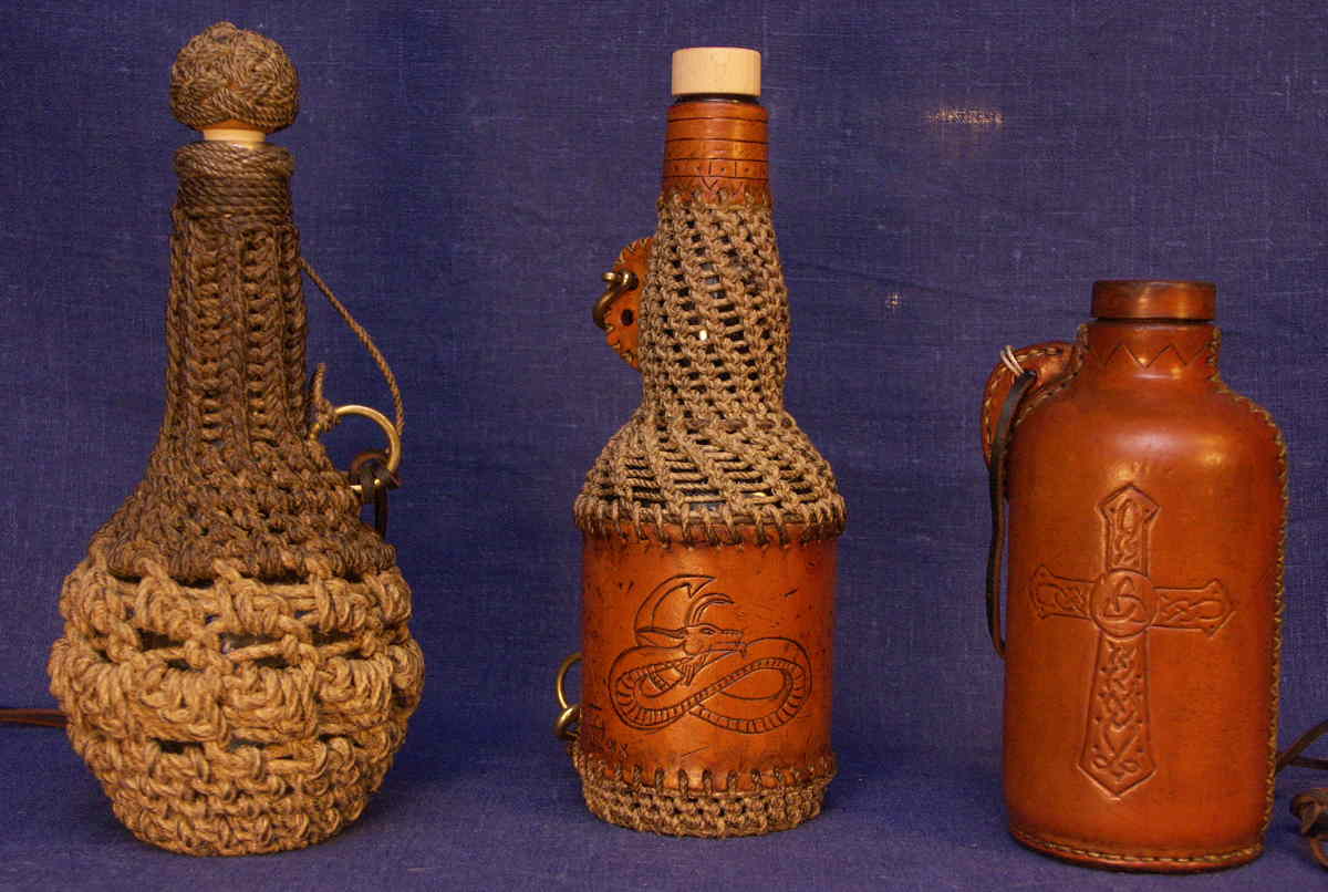 Bottles covered with rope and leather.
